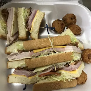 A club with 5 tiny hush puppies at 1 dollar per puppy.  Unbelievable