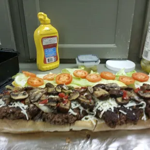 90/10 grilled burger with sauteed onions &amp; mushrooms. Dressed to your liking