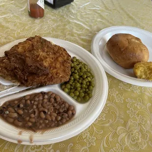 Fried pork chop with sweet peas and black eyed peas