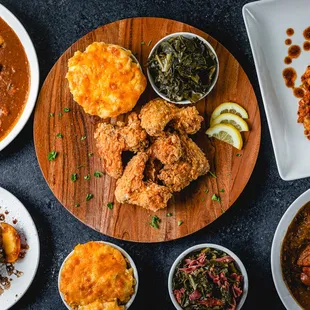 a variety of dishes on a wooden platter