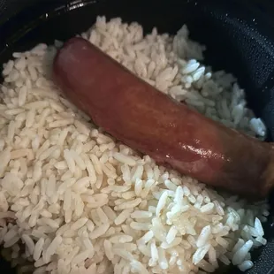 A joke of a bowl of red beans and rice with a hot dog catfishing as &quot; andouille chicken sausage&quot;