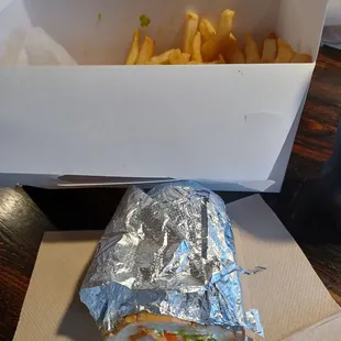 Half of a catfish and shrimps poboy with fries, $24.