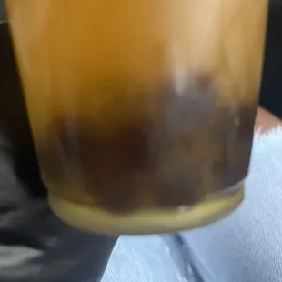 a person holding a drink