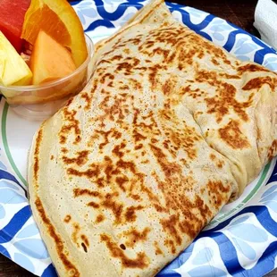 Ham, egg, and cheese crepe with side of fruit