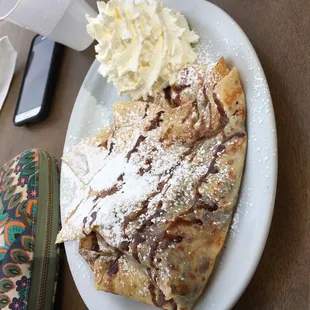 Monkey crepe with Nutella, banana, and chocolate drizzle.