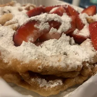 strawberries and powdered sugar on top