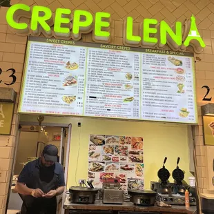 a man preparing food in a restaurant
