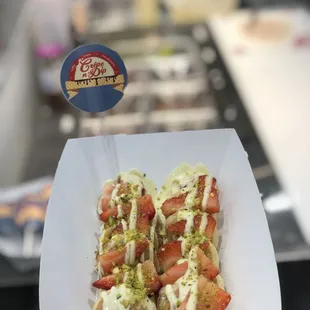 Mini Pancakes with white chocolate, strawberries and pistachios