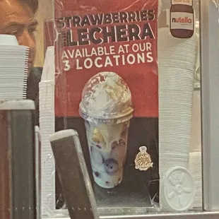 a man in a strawberries ice cream sundae
