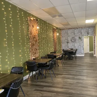 a dining area with tables and chairs