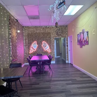 a room with a table and chairs