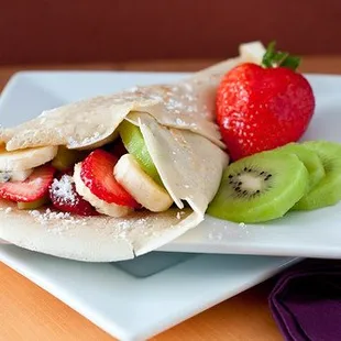 Full House Crepe: Includes fresh strawberries, bananas, &amp; kiwi, 2 ice cream scoops, nutella, powdered sugar, chocolate syrup, &amp; whipped crea