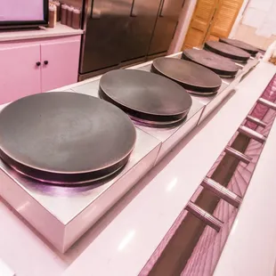 three pans on a stovetop