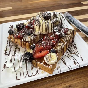 Belgian waffle with Nutella, banana, strawberry, and mixed berries. Of course they also had whip cream and a scoop of vanilla ice cream!!