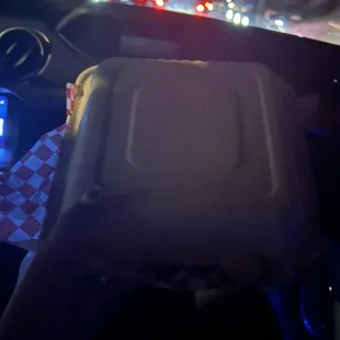a person driving a car at night