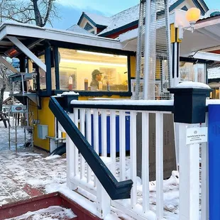 a blue and white cart in the snow