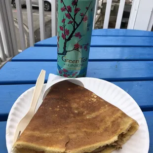 a plate of pancakes and a can of soda