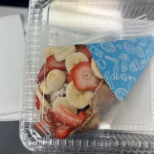 a person holding a plastic container