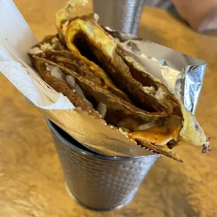 a basket of crepes on a table