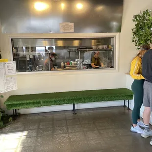 a group of people in a kitchen