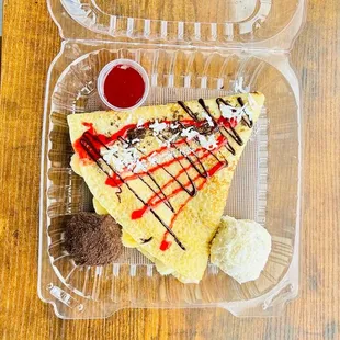 a crepe in a plastic container