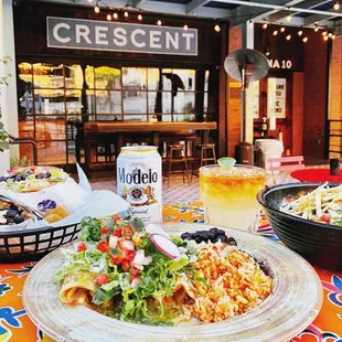 a plate of food and a glass of beer