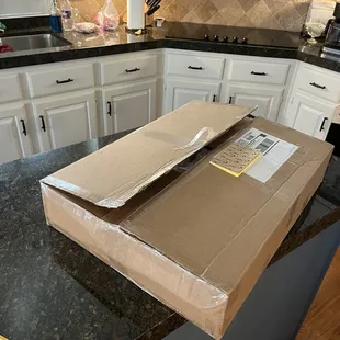 Full box that the wrapped print came in