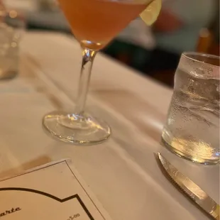 a cocktail and a menu