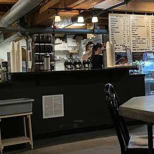 a woman working behind the counter