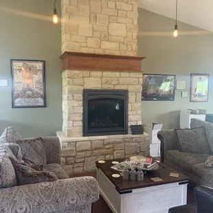 a living room with couches and a fireplace