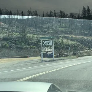 a sign on the side of the road