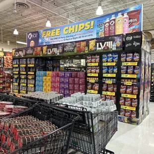 a grocery store with a cart of chips