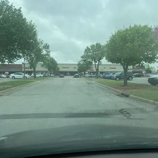 a view of a parking lot from inside a car