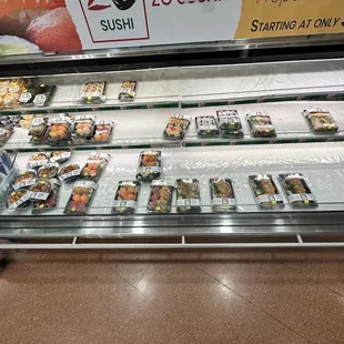 a sushi display in a store