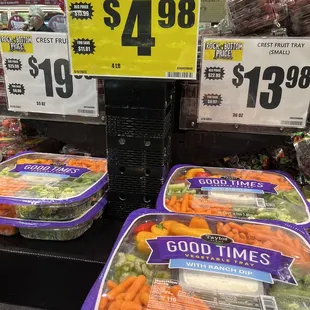 a display of carrots and broccoli