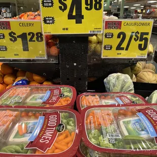 a display of carrots and broccoli