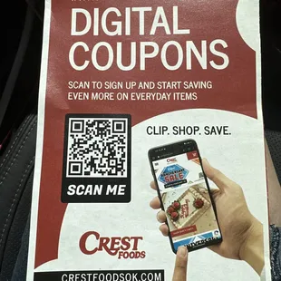 a hand holding a cell phone with a qr code on it