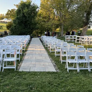 Seating for wedding ceremony at the wooded pergola location