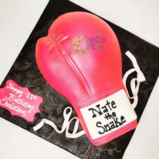 a pink boxing glove cake