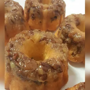 Incredibly moist cakes soaked in a very satisfying rum glaze. This yellow cake base is topped and baked with pecans throughout.