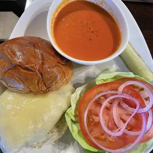 Grilled chicken sandwich with Swiss cheese and tomato bisque soup
