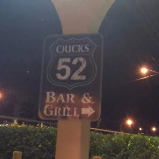 a sign for a bar and grill