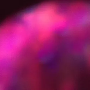 a blurry image of a pink ball