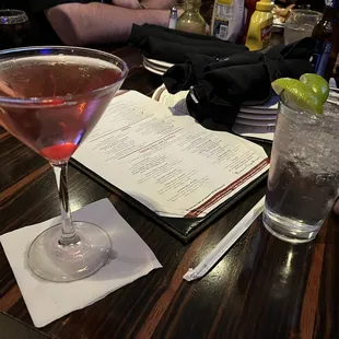 a cocktail and a menu