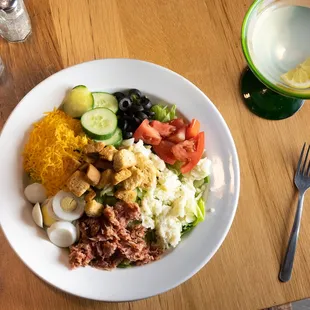 Iceberg lettuce * tomatoes* bacon * cucumbers* croutons * hard boiled egg * shredded and mozzarella cheese