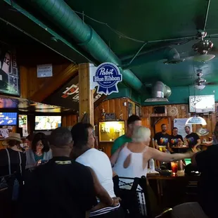 a group of people sitting at a bar