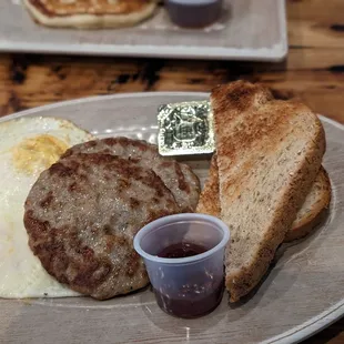 Eggs over medium, pork sausage, wheat toast, it was alright.