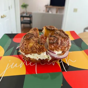 Jalapeño cheddar bagel w plain cc, tomato and onion