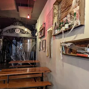 a hallway with tables and a clock