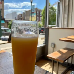 a glass of beer on a table